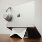 White dual-mode stand with laptop and headphones